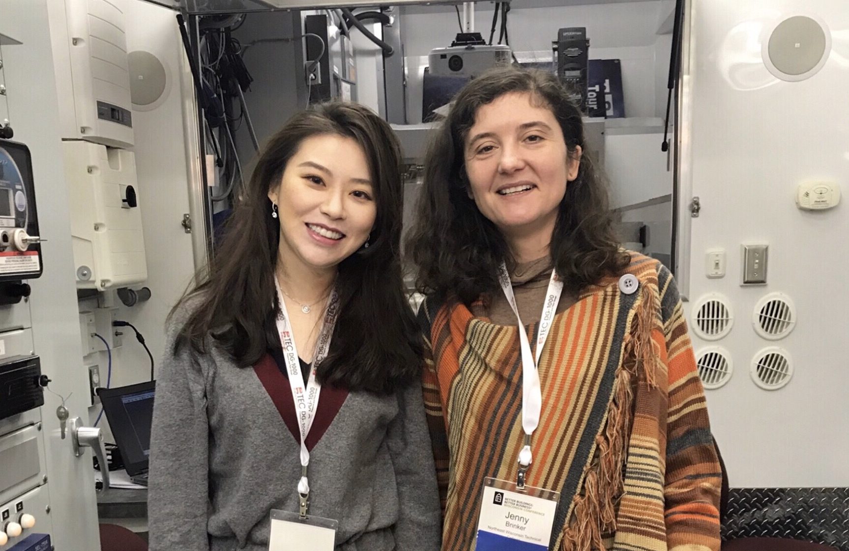 Two women smiling.