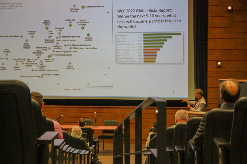 Presenter showing slides at 2022 conference.