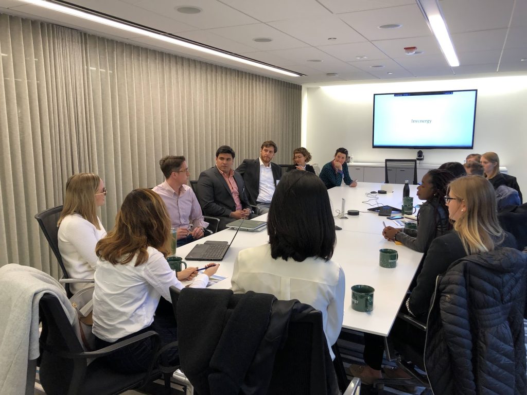 Students sitting around a table on the Milwaukee EAP delegation trip in 2023.
