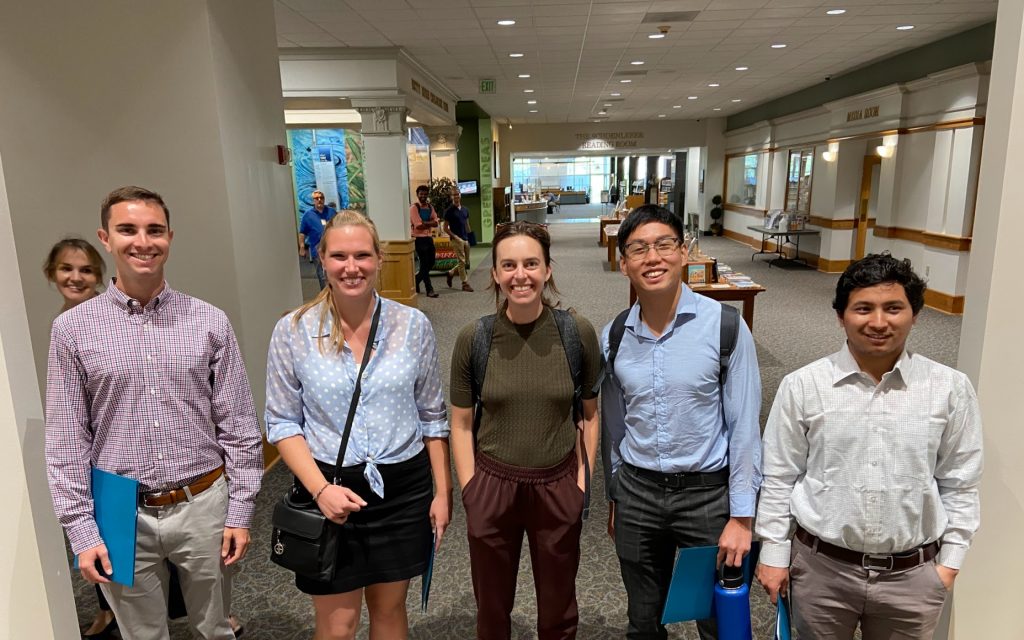 Students and faculty smile on an EAP networking trip.