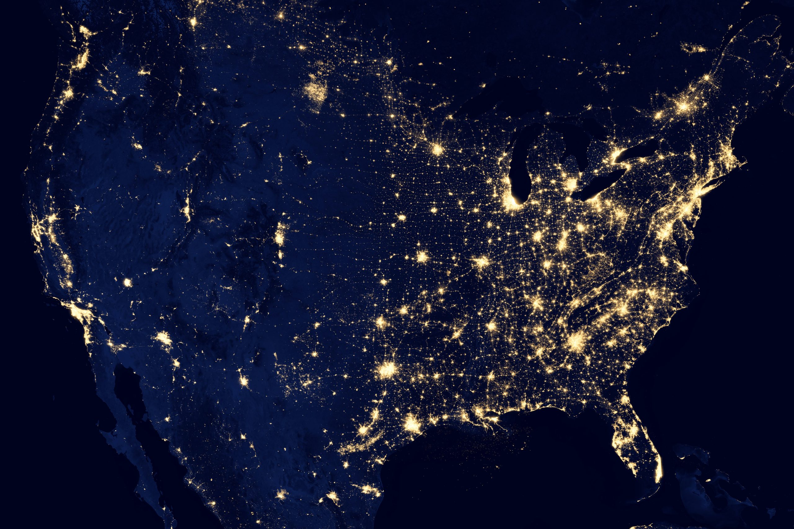 North America from satellite view, lit up by city lights.