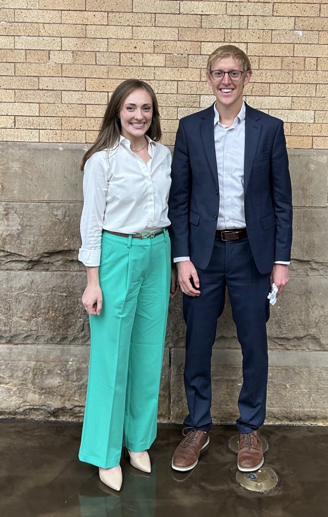 Two EAP alums posing for photo at conference